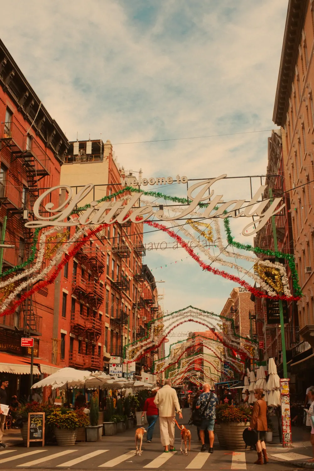 The Welcome to Little Italy sign above a Manhattan street.